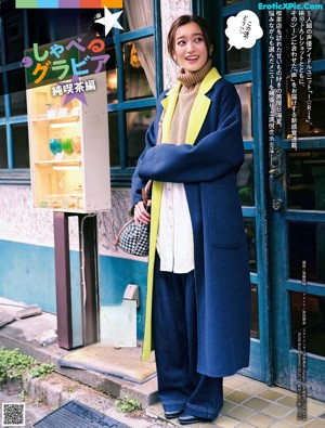 A woman standing in front of a vending machine.