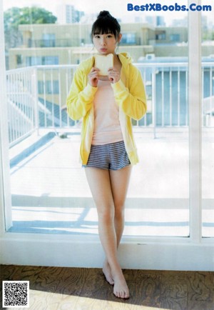 a woman in a white shirt is posing for a picture