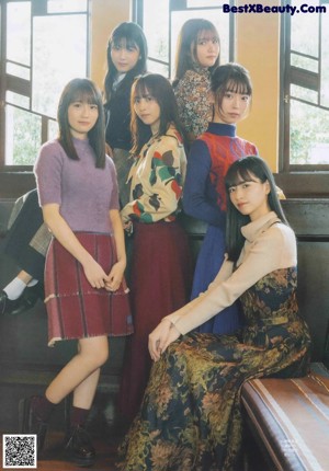 A group of young women standing next to each other.